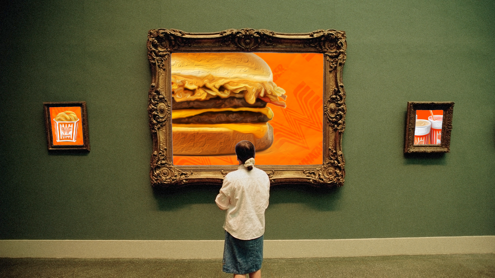 A person looking at an artwork of a burger in a museum.